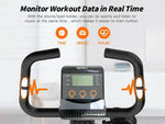 Exercise bike with digital display and heart rate monitoring features on a white background