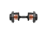 Top view of adjustable dumbbell with weight increments marked on dial for home gym