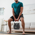 Man performing kettlebell squat at home with Ativafit Adjustable Kettlebell 5-44 lbs, ideal for space-saving fitness routines.