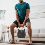 Man performing kettlebell squat at home with Ativafit Adjustable Kettlebell 5-44 lbs, ideal for space-saving fitness routines.
