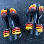 Spark Adjustable Dumbbells - Women Beginners | Easy Use, 27.5 Lbs in red, yellow, and black color scheme on gym floor, ideal for novice lifters.