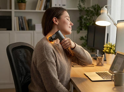 A woman using Ativafit hot&cold massage gun