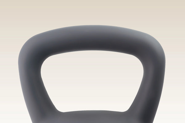 Close-up of a dark gray kettlebell handle against a light beige gradient background.
