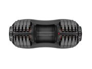 Side view of adjustable dumbbell showing weight plates and dial for fitness equipment