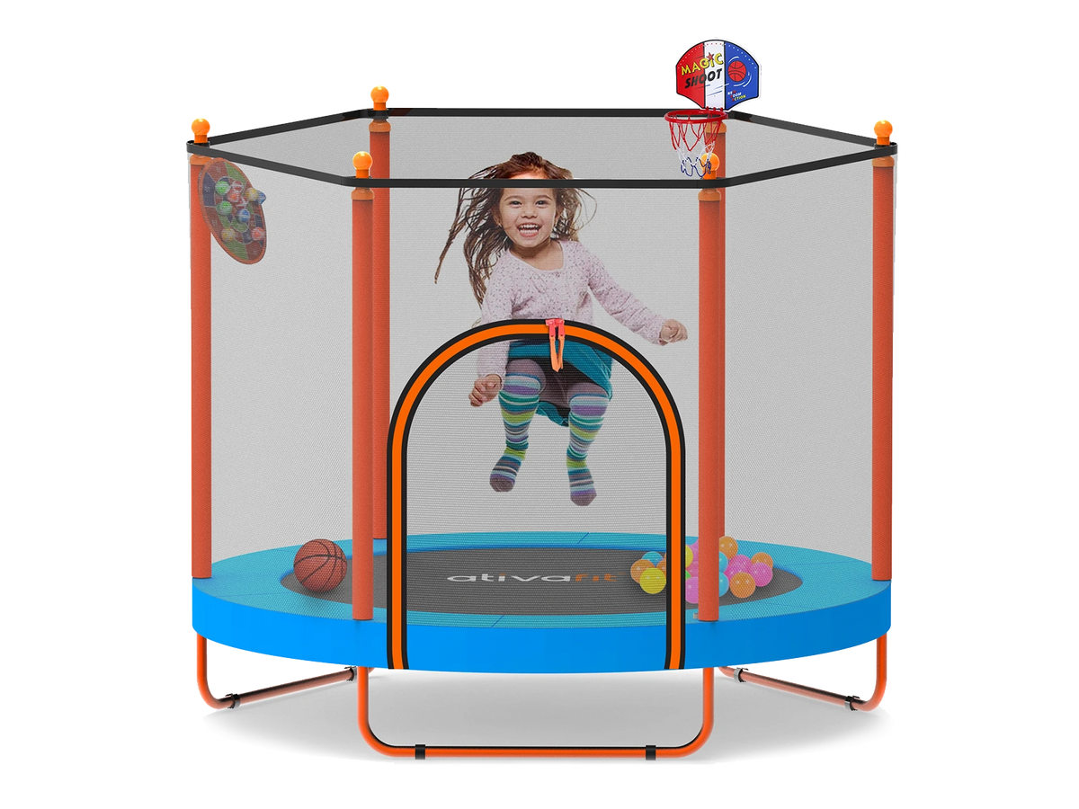 Child playing inside a  trampoline with basketball hoop and sports ball toys on a white background