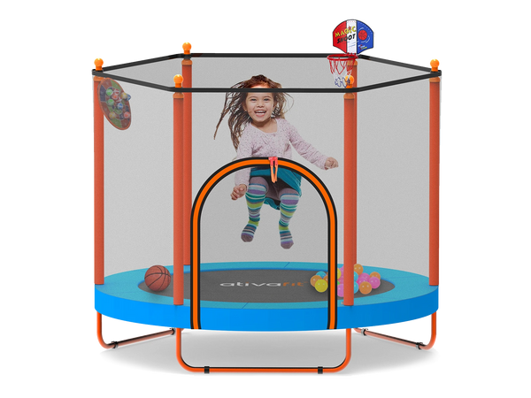 Child playing inside a  trampoline with basketball hoop and sports ball toys on a white background