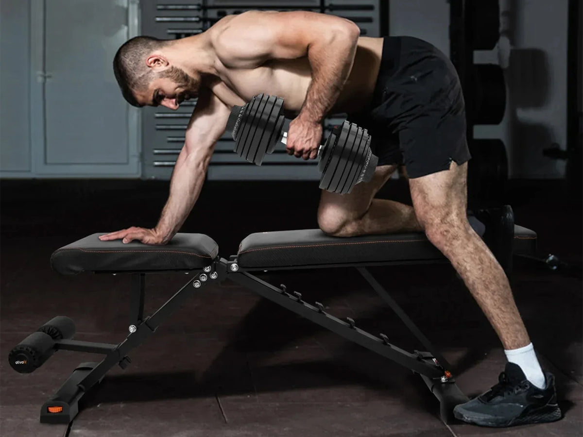 Single-arm dumbbell row supported on an adjustable workout bench