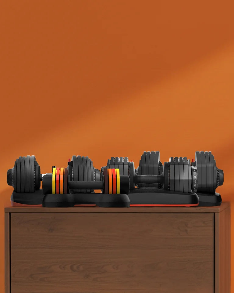 Adjustable dumbbells of various weight ranges placed in living room