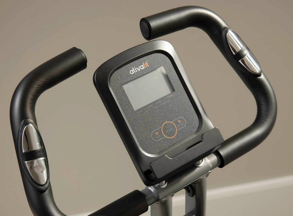 Close-up of a stationary bike handlebar with an 'ativfit' display on a neutral background