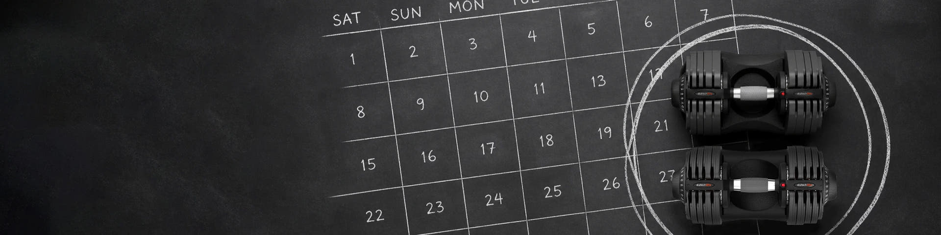 Two black adjustable dumbbells placed on a dark chalkboard-style background next to a white calendar grid with circled dates.