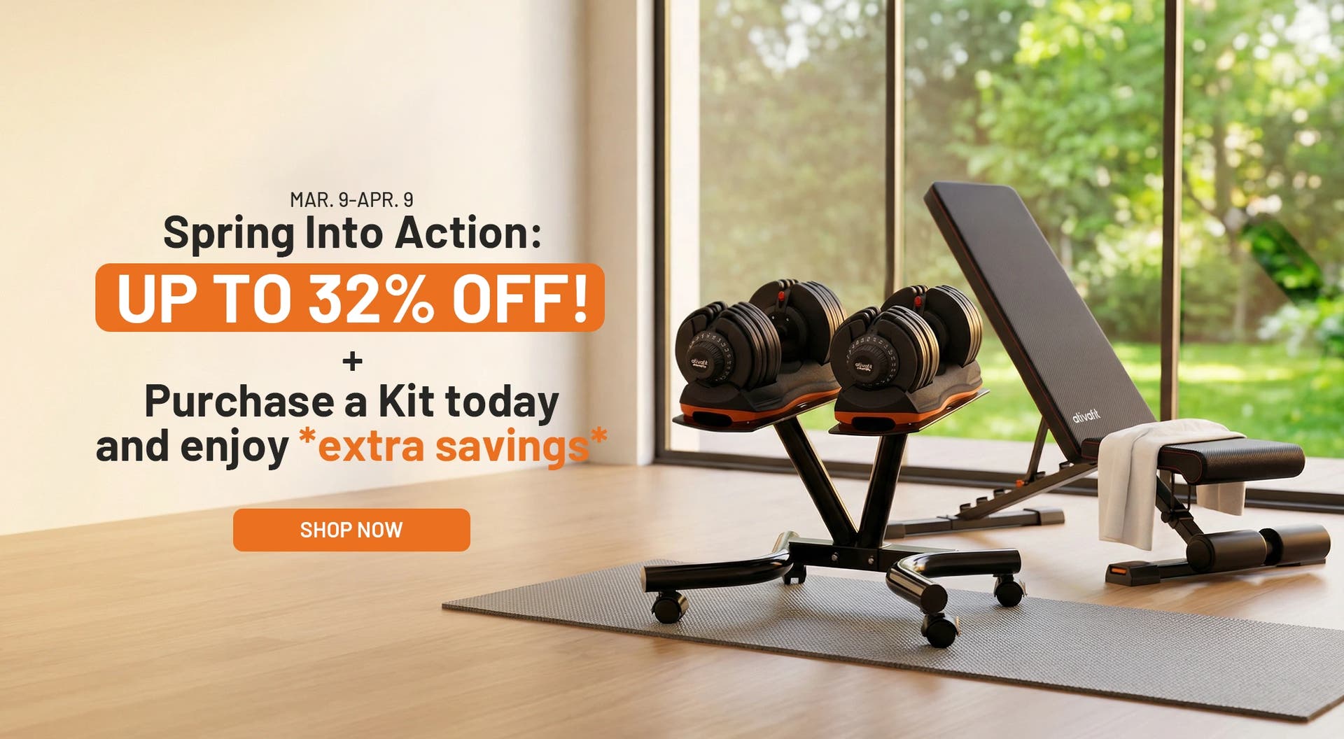 Gym equipment including adjustable dumbbells and a bench in a room with a window view.