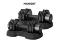 Two black adjustable dumbbells with weight plates on a matching black stand, shown on a white background with the text 'MIDNIGHT' above them. The brand name 'olivakt' is visible on the dumbbell ends.